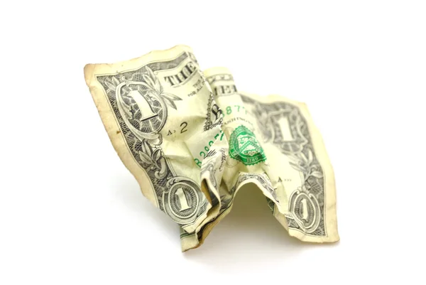 Смятый доллар на белом — стоковое фото