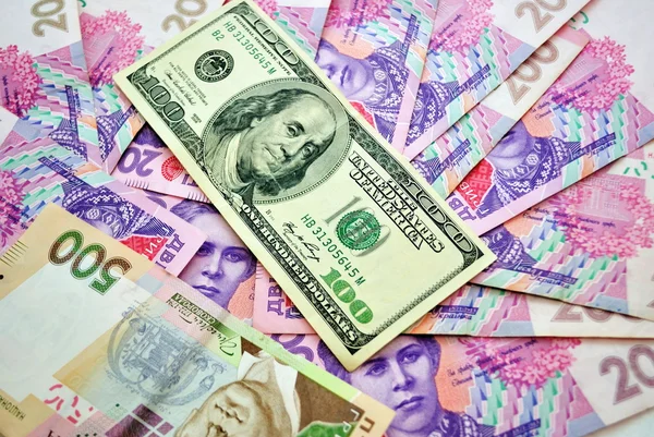 stock image Beautiful background with money American dollar and Ukrainian hryyvnya