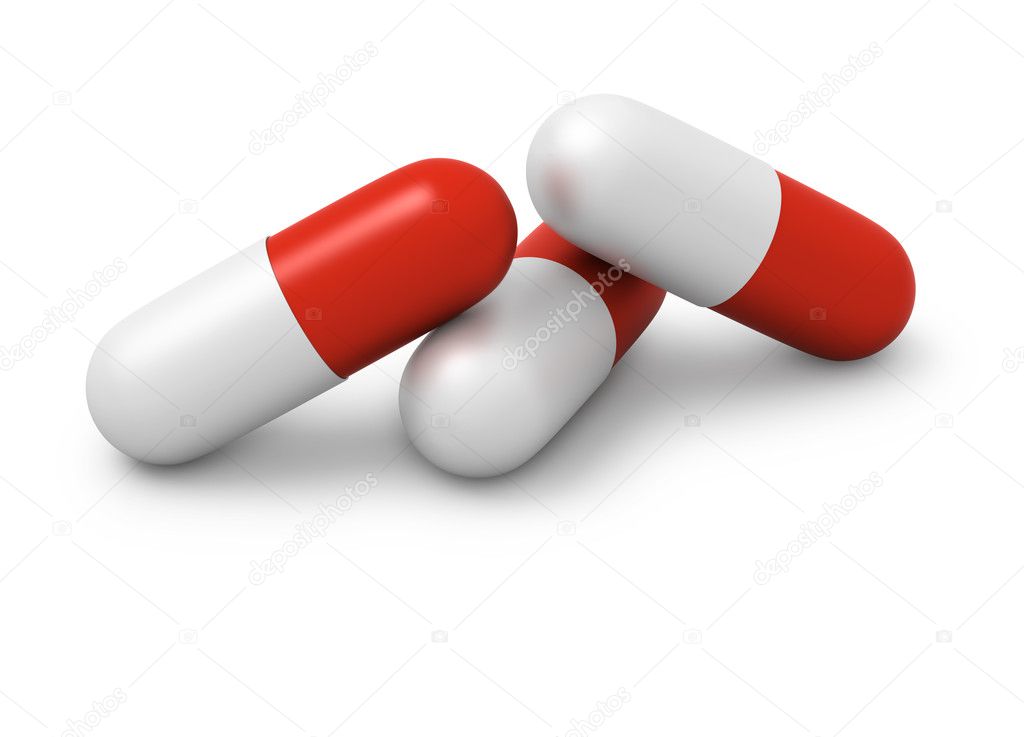 Three red and white capsules close up