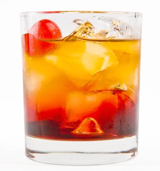 A delicious glass of whiskey with ice cubes and cherry — Stock Photo, Image