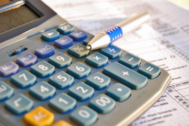 Tax calculator and pen clipart