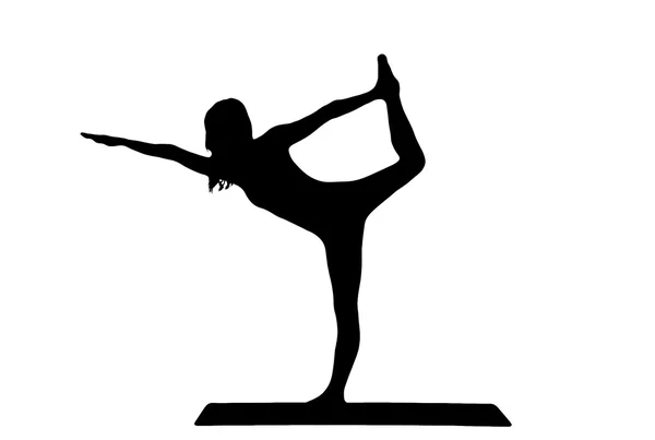 Silhouette of a young women practicing yoga — Stock Photo, Image