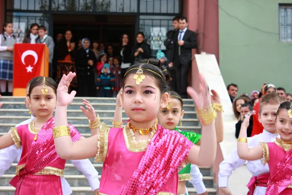 Children students dancing in Indian costumes for 23 April Children Festival April 23, 2011 in Darica, Kocaeli, Turkey.