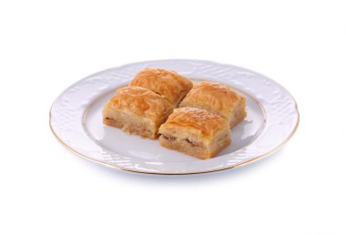 Turkish traditional dessert Baklava served in porcelain dish iso clipart