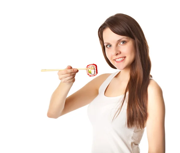 Jonge vrouw is eten sushi — Stockfoto