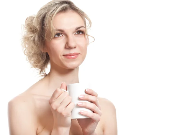 Young blond woman is drinking tea — Stock Photo, Image