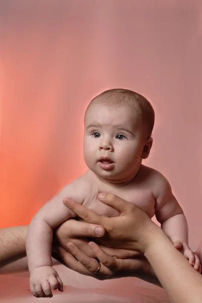Little boy at the hands of parents — Stock Photo, Image
