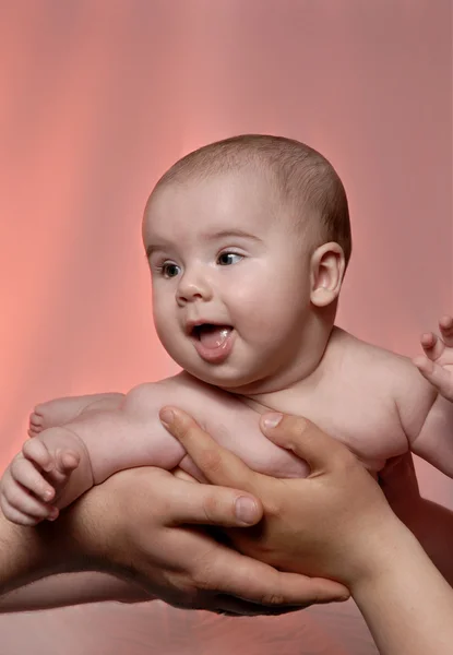 Baby at the hands of parents — Stock Photo, Image