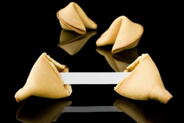 Fortune cookie with a blank message clipart