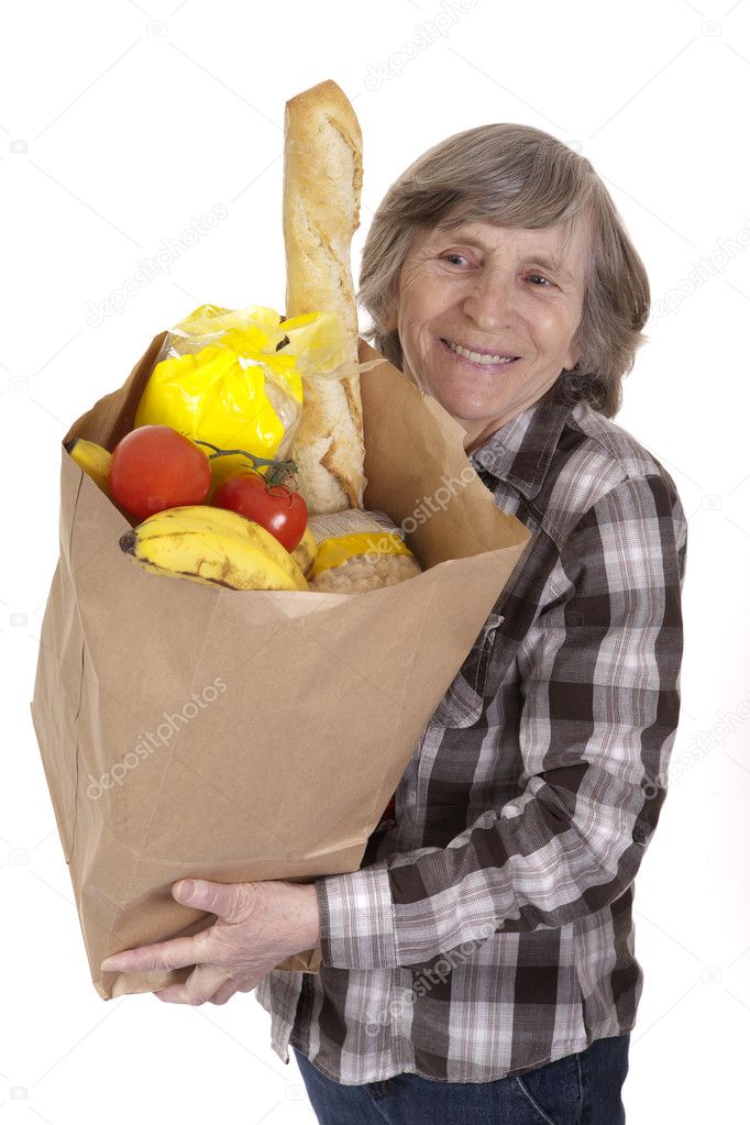 Senior carrying a bag of groceries
