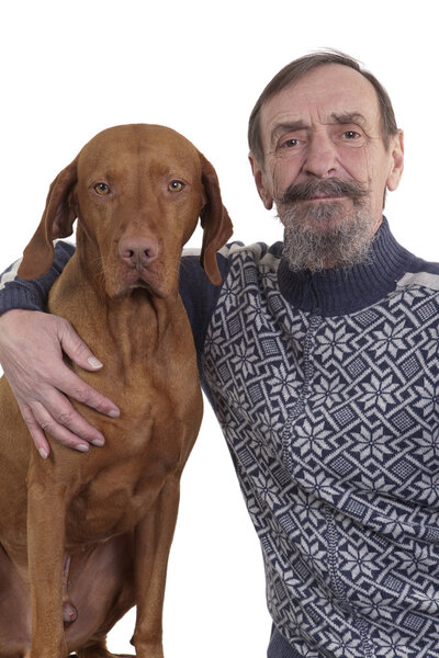 Senior man and his dog posing together