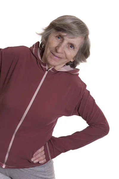 Retired woman practicisng physical exercise — Stock Photo, Image