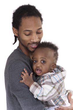 Father holding toddler in arms clipart