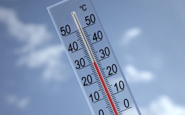 Thermometer on sky background showing 30°c