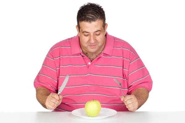 Fat man eating a apple — Stock Photo, Image