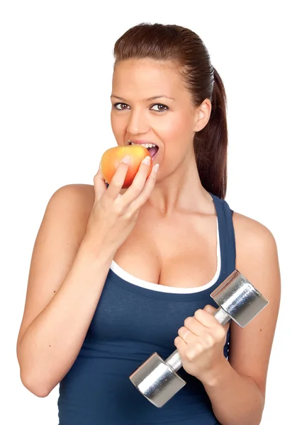 Girl doing gymnastics and eating a apple — Stock Photo, Image