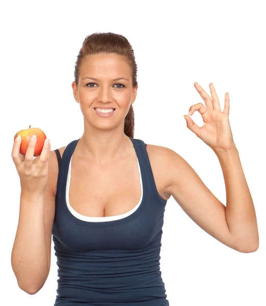 Gymnastics girl with an apple sitting saying OK — Stock Photo, Image