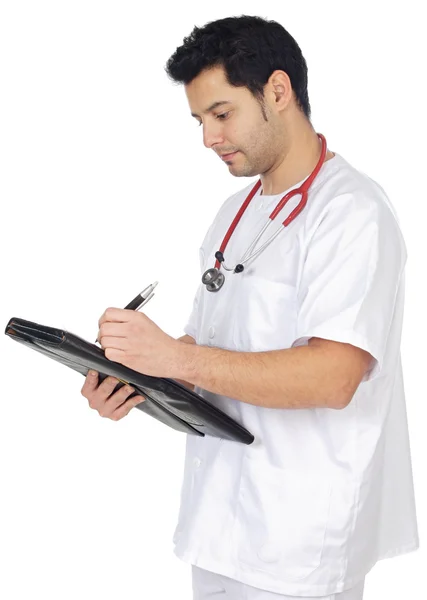 Jeune médecin prenant des notes dans un carnet — Photo