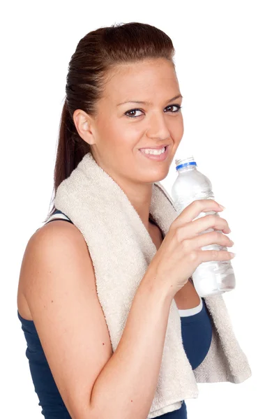 Chica de gimnasia con una toalla y agua Imagen de archivo