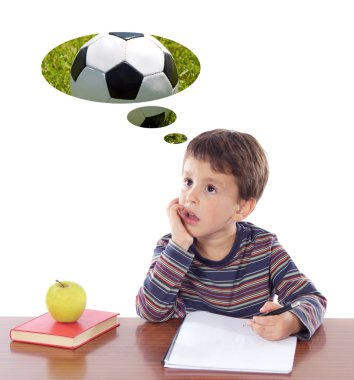 Adorable boy in class thinking about the ball clipart