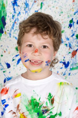 Boy playing with painting clipart