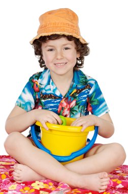 Adorable boy playing in the beach clipart