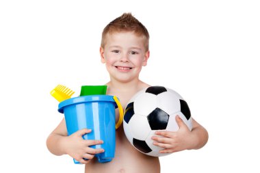 Adorable boy playing with toy for the beach clipart