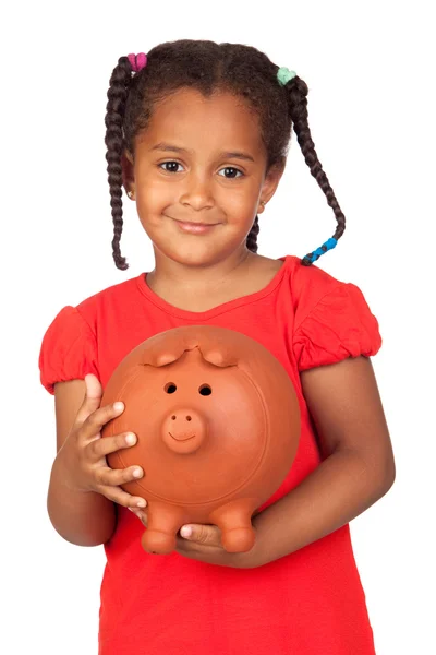 Stock image African little girl with a big piggy-bank