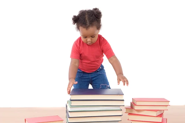 Adorável bebê africano com muitos livros — Fotografia de Stock