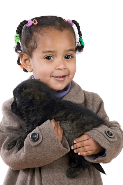 Afrikaanse baby een pup houden op haar armen — Stockfoto