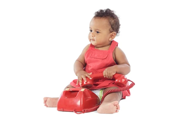 Baby with red phone — Stock Photo, Image