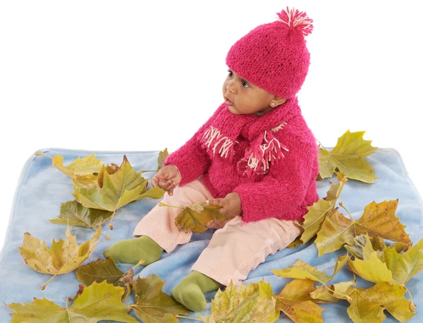 Baby playing with leaves — Stock Photo, Image