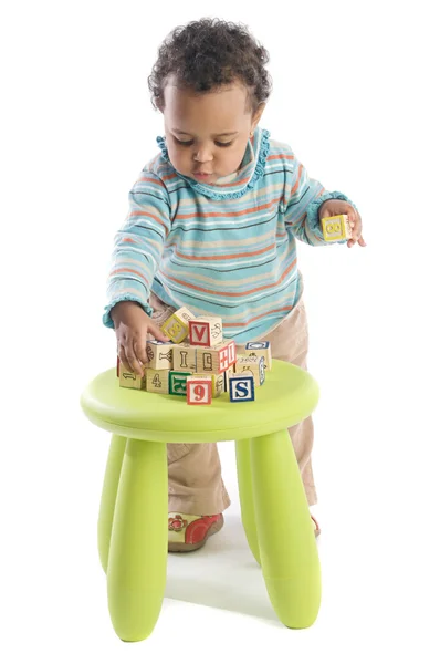 Girl playing with small pieces — Stock Photo, Image