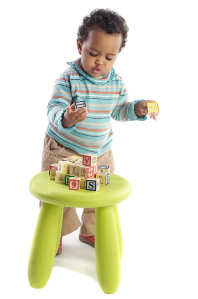 Girl playing with small pieces — Stock Photo, Image