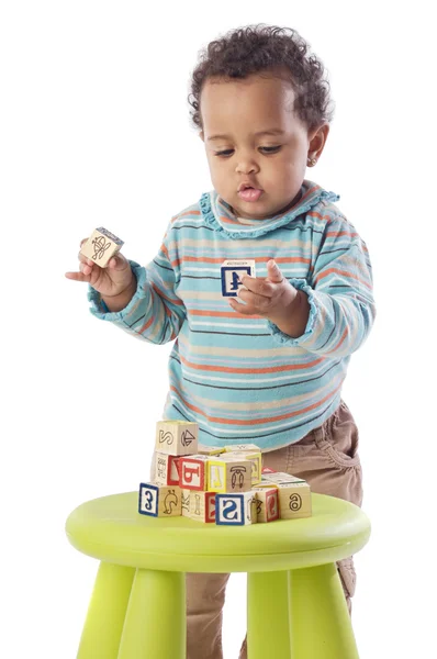 Baby playing with small pieces — Stock Photo, Image