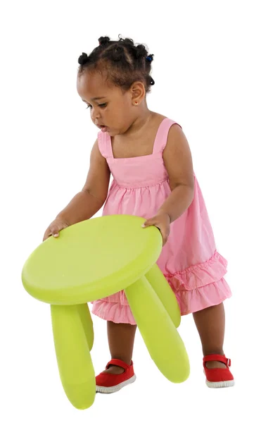 African baby catching the stool — Stock Photo, Image