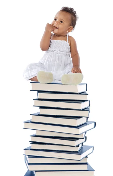 Bebeğin üzerine bir kitap kule — Stok fotoğraf