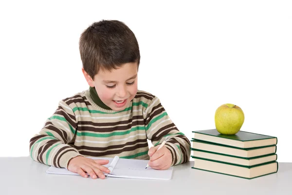 Criança adorável escrevendo na escola — Fotografia de Stock