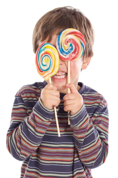 Criança comendo dois pirulitos — Fotografia de Stock
