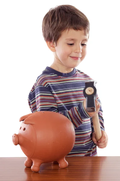 Schattige kleine jongen met hamer voor het breken van de spaarpot — Stockfoto