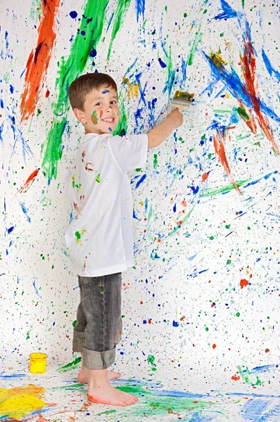 Boy playing with painting — Stock Photo, Image