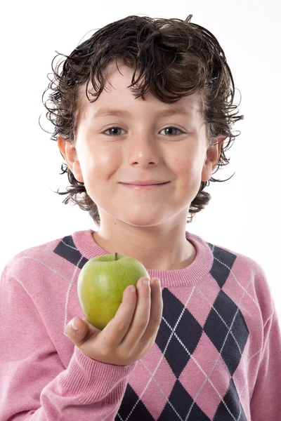 Bambino sorridente con una mela verde — Foto Stock