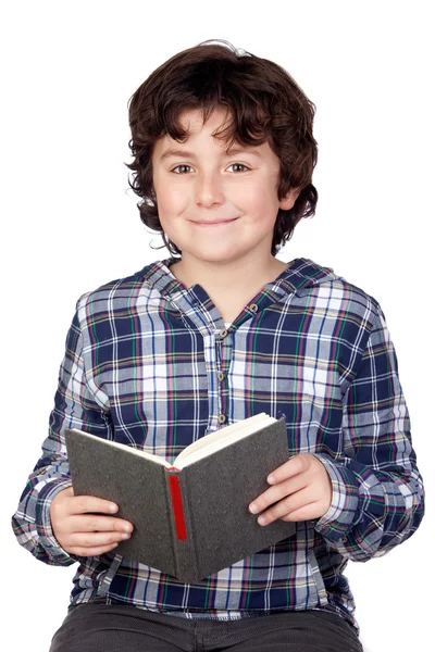 Criança estudante com um livro — Fotografia de Stock