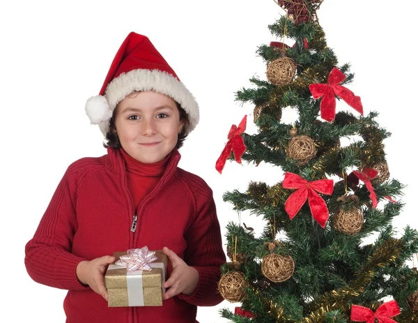 Criança bonita com árvores de Natal e presente — Fotografia de Stock