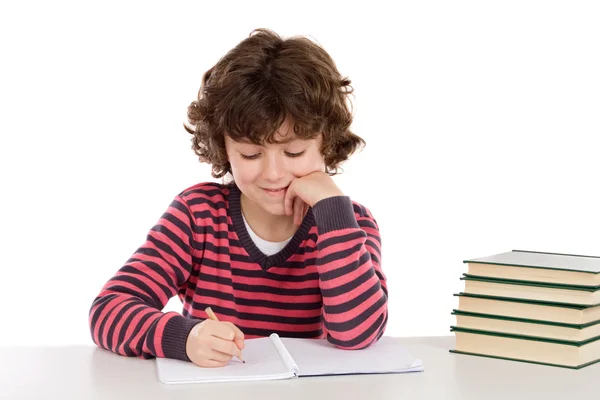 Criança adorável escrevendo na escola — Fotografia de Stock