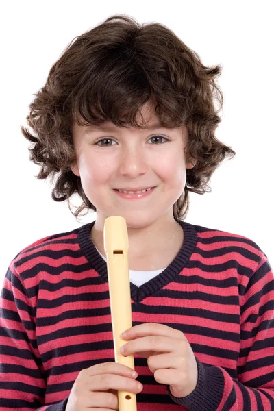 Красивый ребенок играет на флейте — стоковое фото