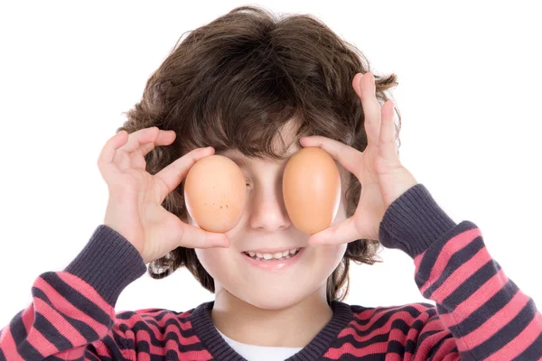 Adorable Child with two eggs on his eyes — Stock Photo, Image