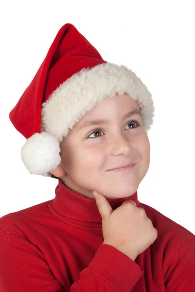 Αξιολάτρευτο παιδί με santa καπέλο σκέψης — Φωτογραφία Αρχείου