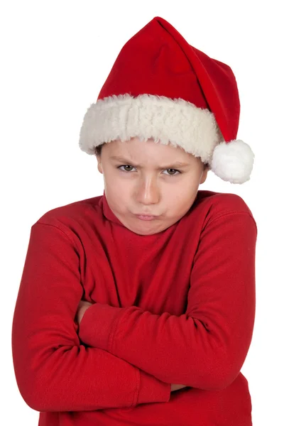 Garçon fronçant les sourcils avec chapeau de Père Noël — Photo