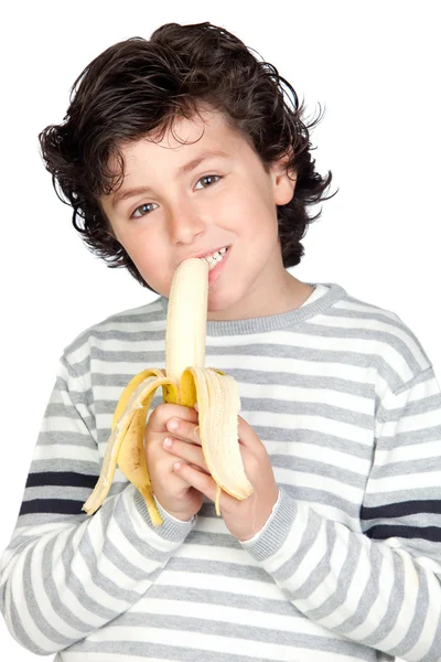 Mooi kind eten van een banaan — Stockfoto